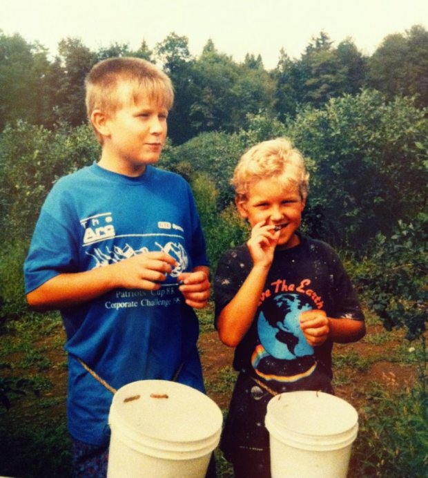 The boys picking berries at a blueberry farm after moving to the United States.  (Photo courtesy of Azedin).  